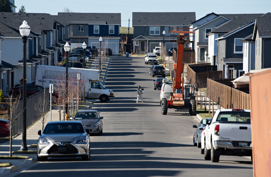 Construction equipment sits near newly built houses Jan. 27 in the North Haven development near Fairgrounds Community Park in north Clark County. The National Association of Home Builders believes tariffs will raise the cost of a single-family home in the United States by $7,500 to $10,000. (Photos by Amanda Cowan/The Columbian files)