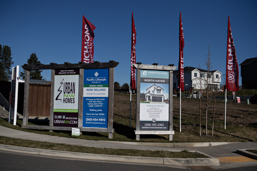 Signs advertise new homes for sale in the North Haven development near Fairgrounds Community Park in Clark County.