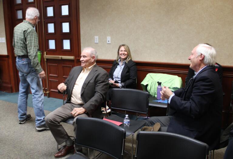 Camas council member John Svilarich, left, greets applicants for the council’s vacant Ward 2 seat, during a special council meeting Tuesday evening, April 8, 2025, inside Camas City Hall. The council interviewed six applicants for the Ward 2 seat formerly held by Bonnie Carter, including Jill Walters, third from left, Jim Roy, second from left, and Gary Gaskill, right.
