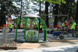 Construction crews install playground equipment at Crown Park in Camas on Friday, April 25, 2025. City of Camas leaders hope to reopen parts of the historic park, including the new inclusive playground, to the public this summer. (Kelly Moyer/Post-Record)