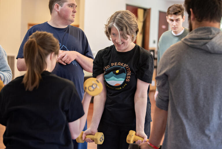 Volunteer Gypsy Martin, center, leads Mountain Tops athletes at Lacamas Lake Lodge on April 3, 2025.