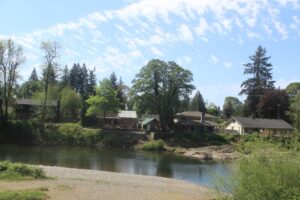 Houses near the Washougal River are viewed from Washougal’s Sandy Swimming Hole park on Friday, May 2, 2025. (Doug Flanagan/Post-Record)